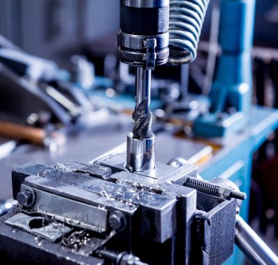 Drilling machine with drill bit for tapping